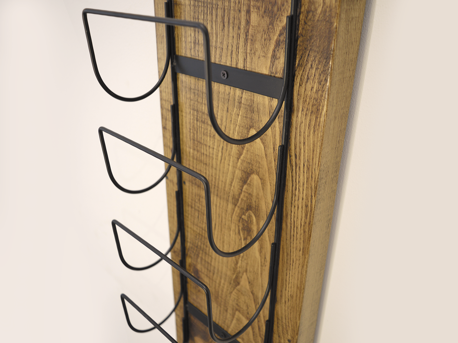 farmhouse style winerack to hold five bottles of wine.