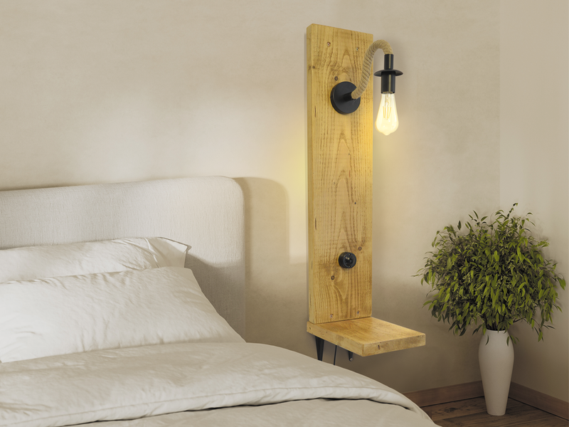 small bedside table with an industrial, rope wall light.